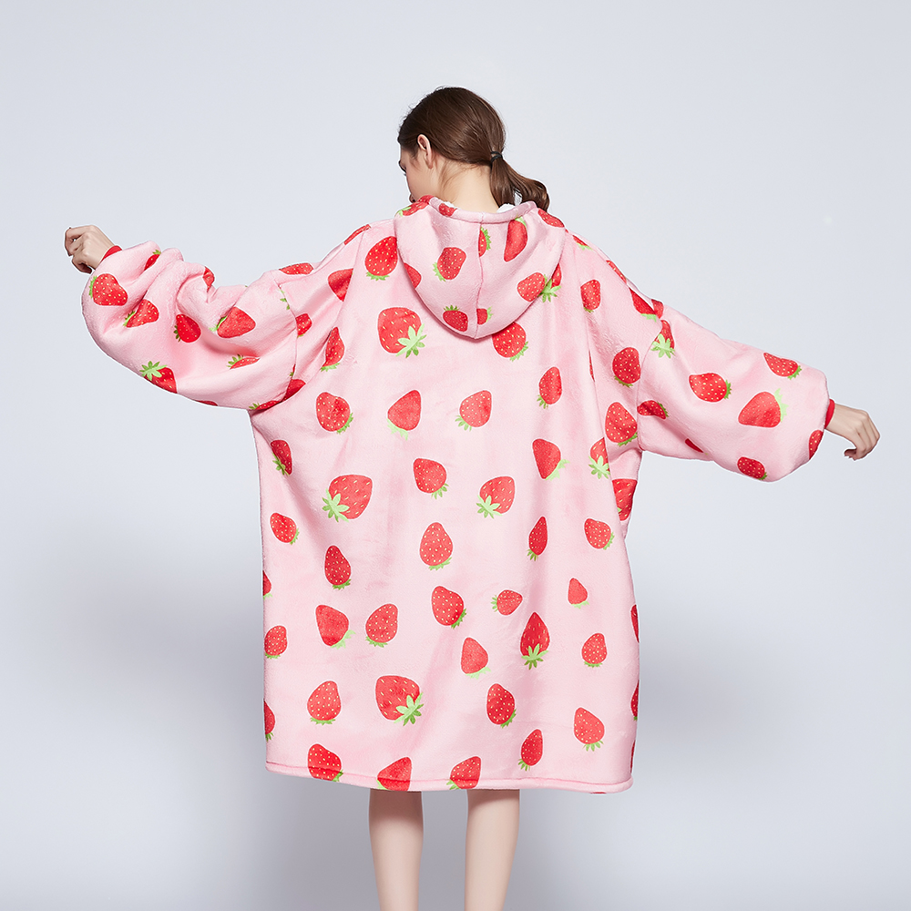 Back view of the Strawberry Crush wearable blanket with arms outstretched showing the all-over strawberry print