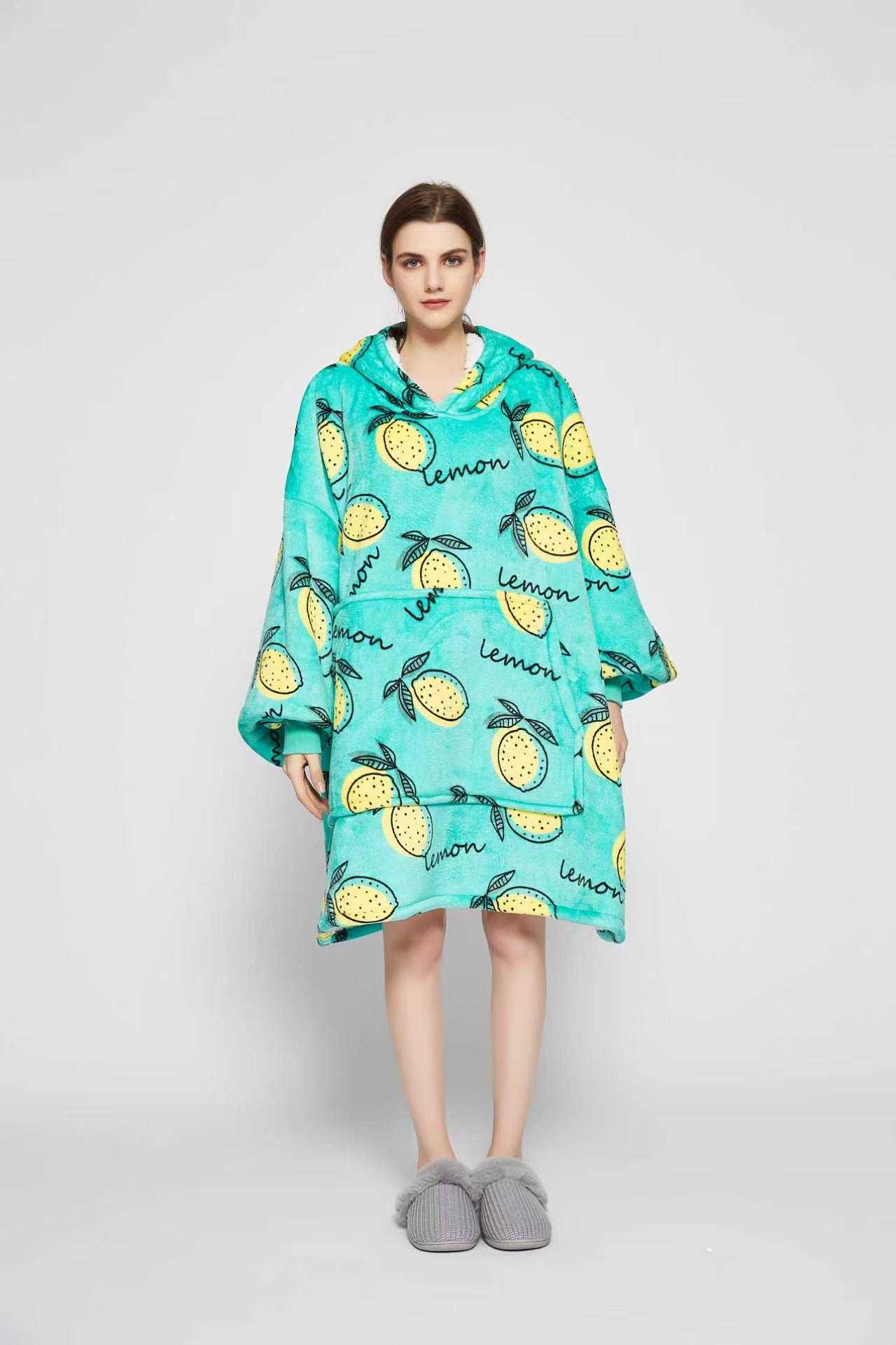 Front view of the Lemon Squeeze wearable blanket showing the sherpa-lined hood and giant front pocket
